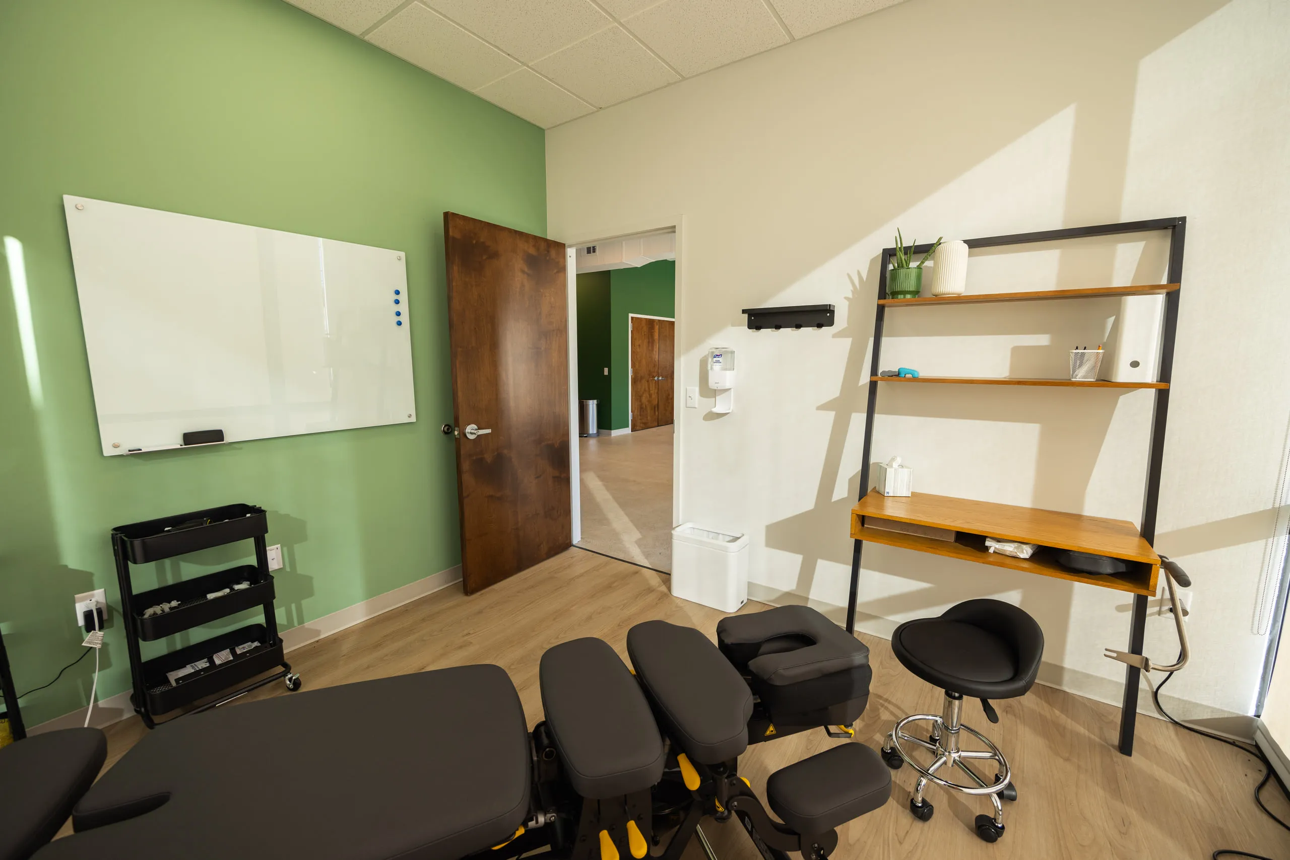 A treatment room with a whiteboard used to walk patients through findings.