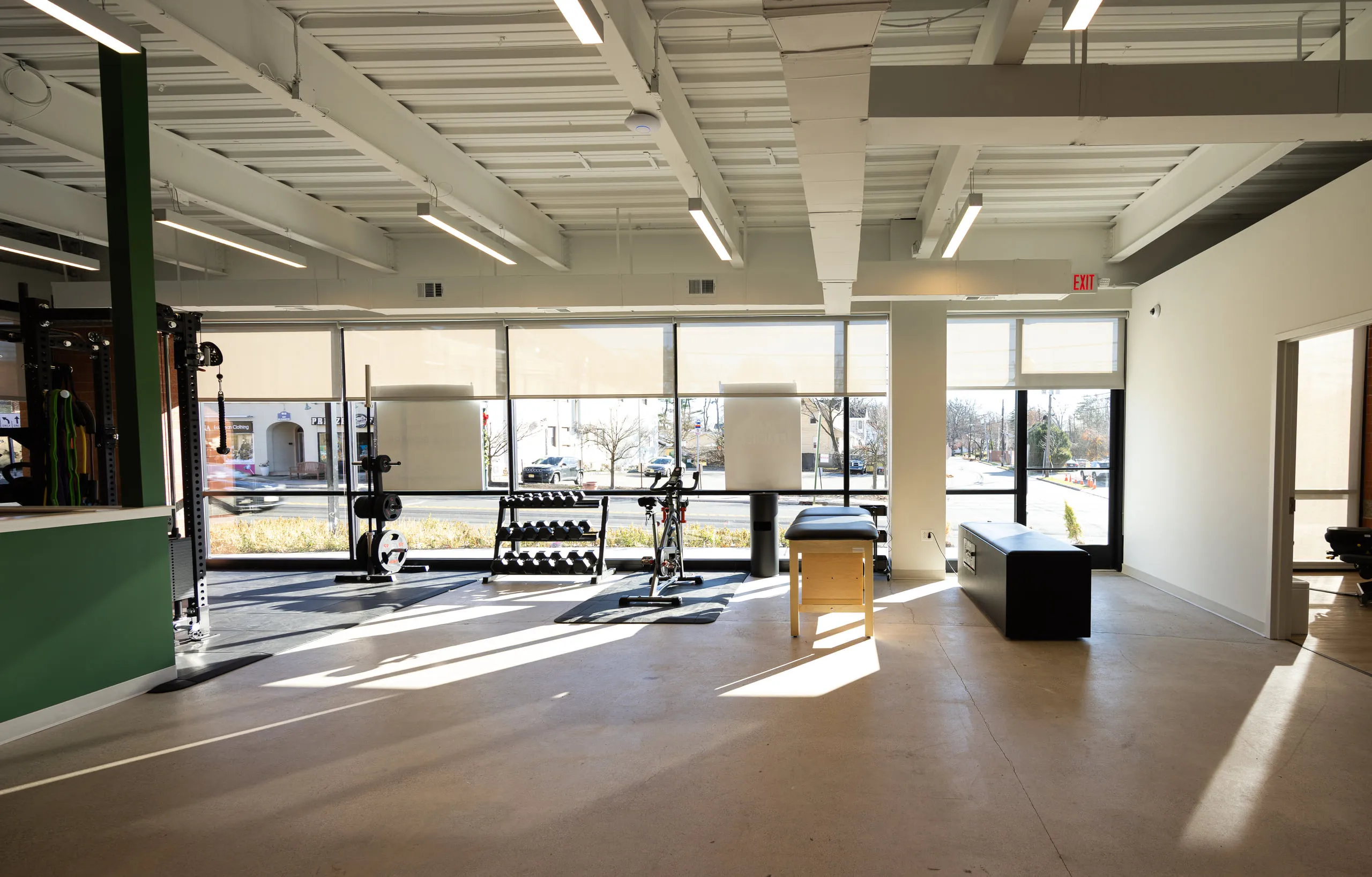 The open training floor of the clinic filled with afternoon light.