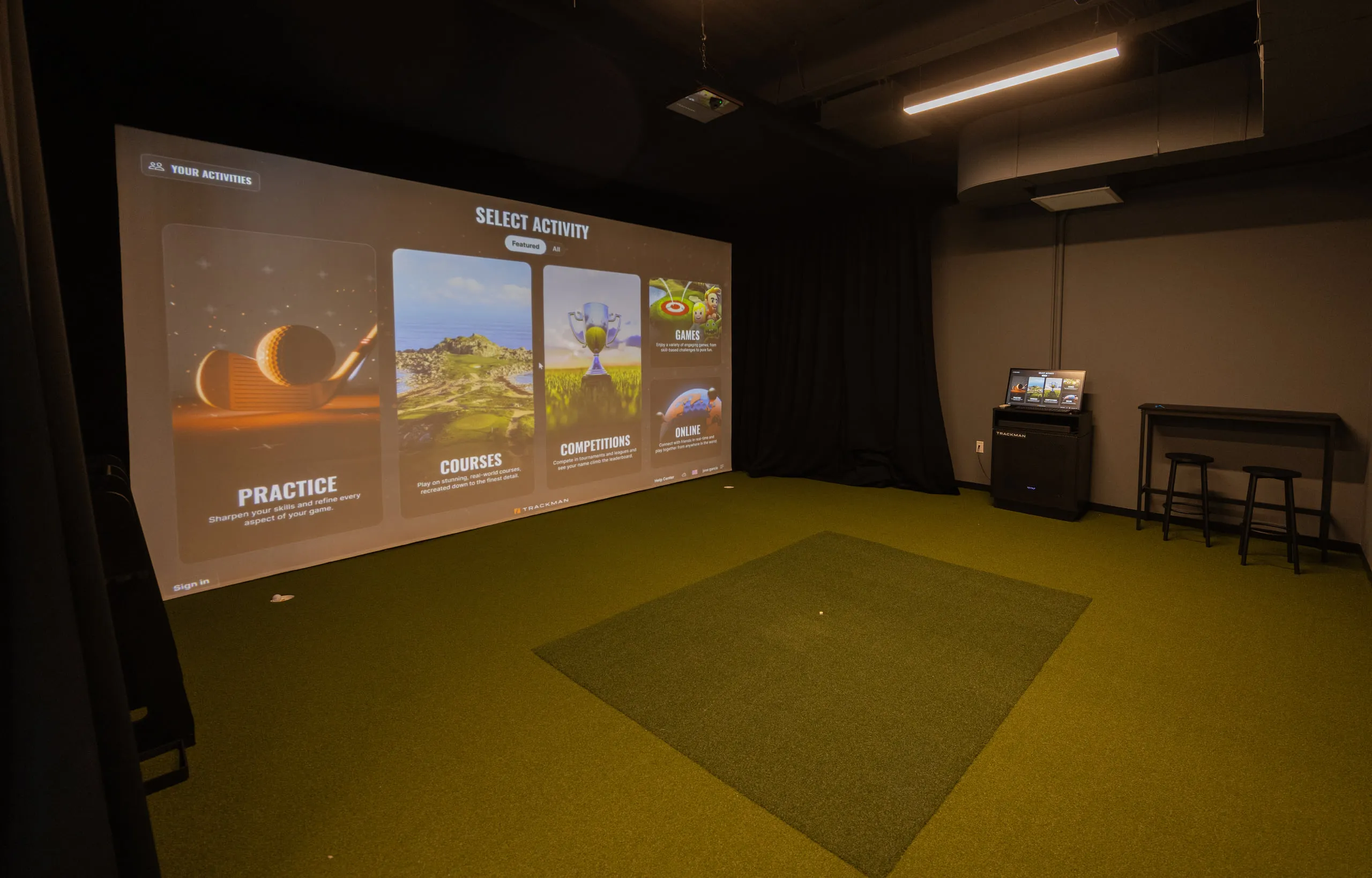 A TrackMan simulator bay at All Square.