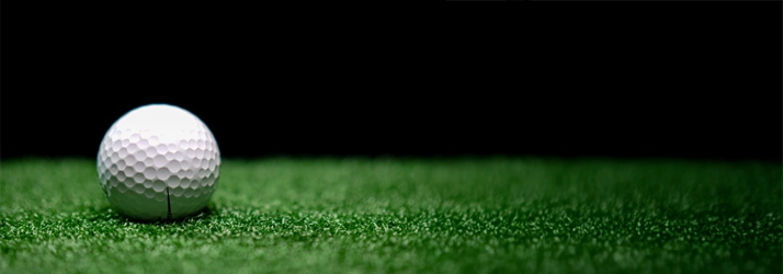 Chiropractic Livingston NJ Indoor Golf Hero A golf ball sitting on artificial turf.